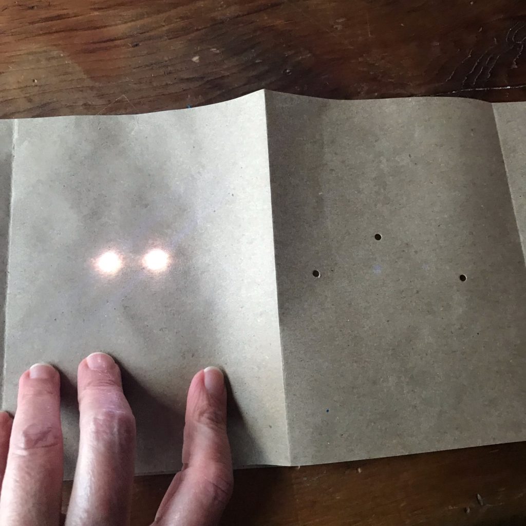 holes punched into paper