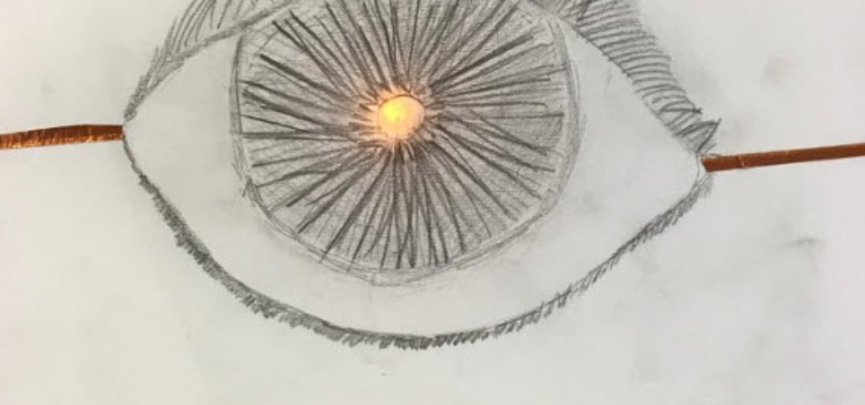 a pencil sketch of an eye lit up by an LED