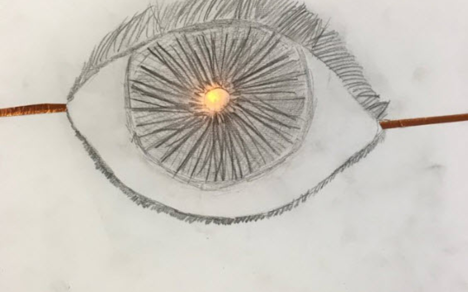 a pencil sketch of an eye lit up by an LED