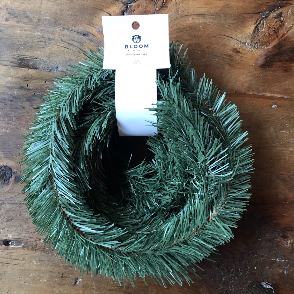 A wrapped coil of faux evergreen