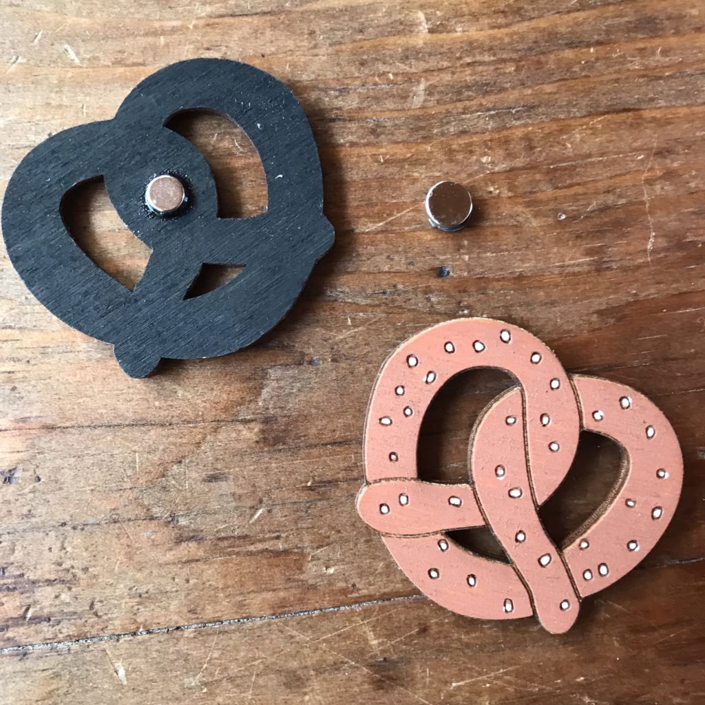 Two magnetic pretzels made of wood