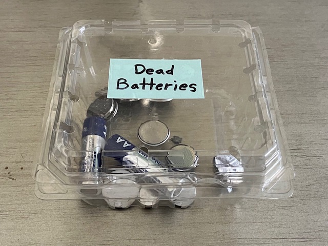 Used coin cell batteries in a clamshell box