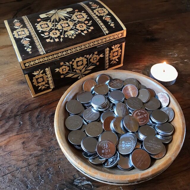 Store your dead batteries:  coin cell batteries in a wooden bowl
