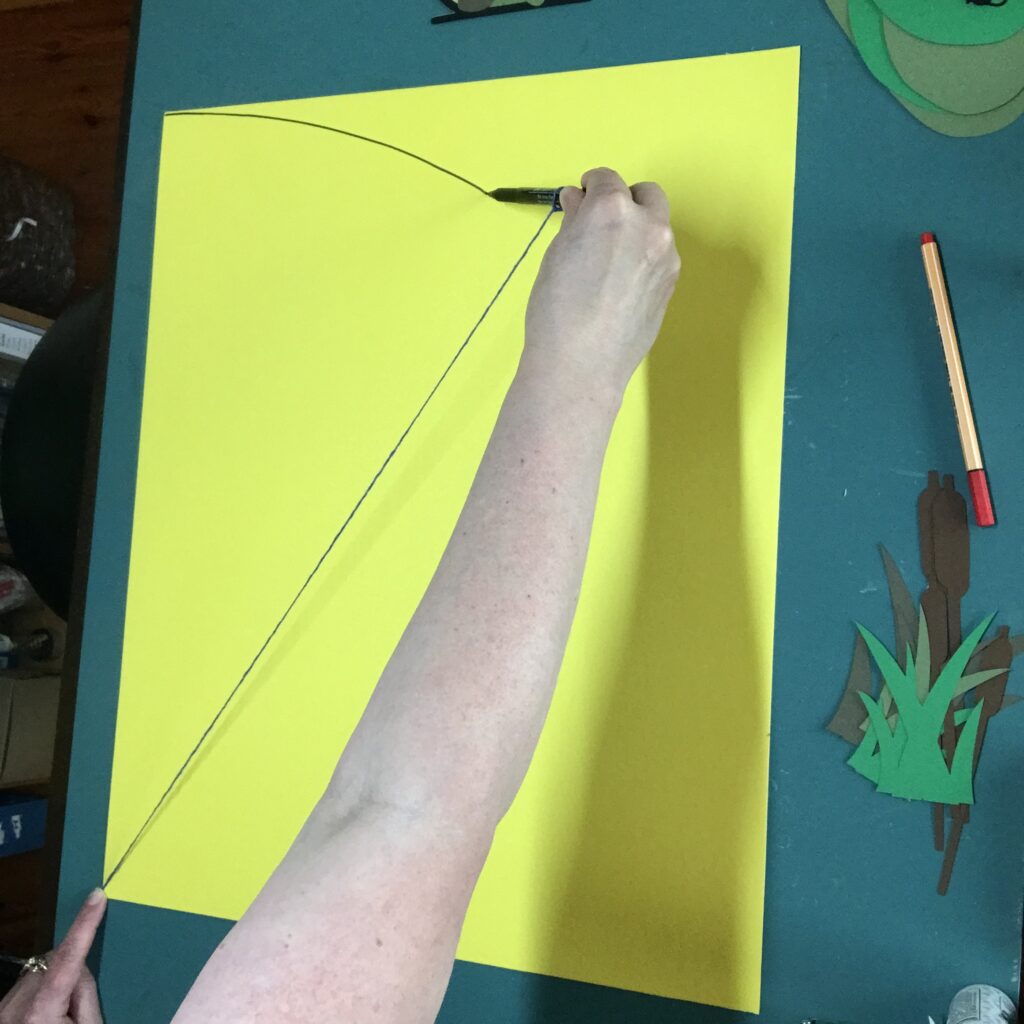 Marking an arc on a school cone