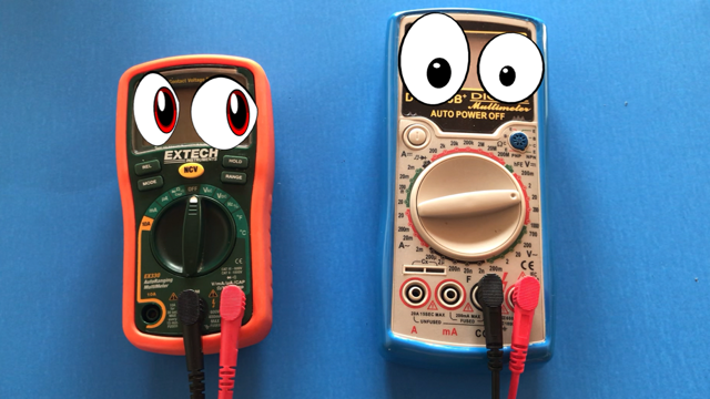 multimeters with cartoon eyeballs placed over the LCD screens