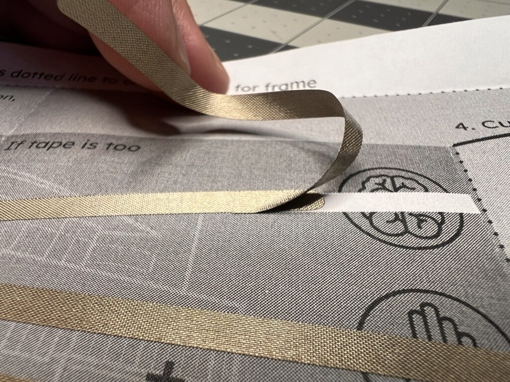 Overlapping two pieces of conductive fabric tape on the ML40 template