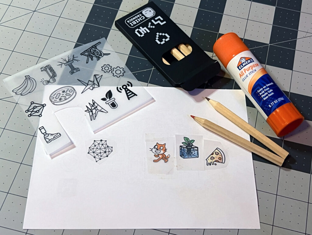 Colored pencils, translucent pictures, and cut-out artwork for the ML40 project